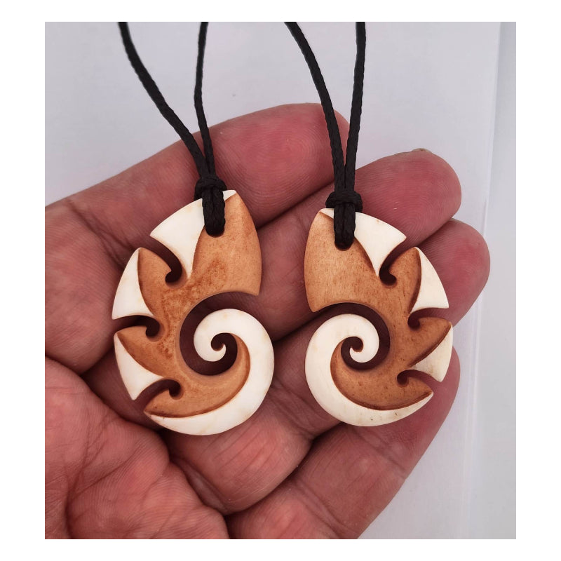 His And Hers Koru Pendants