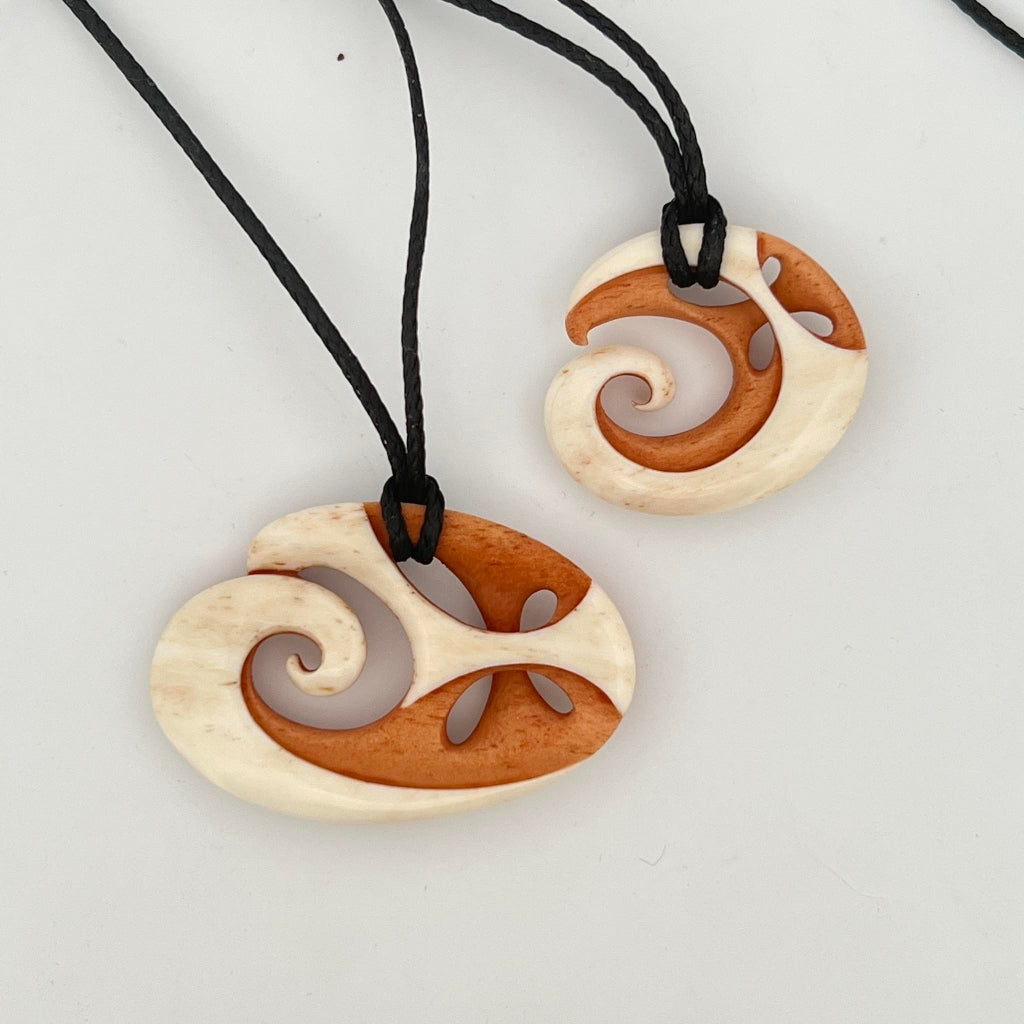 His And Hers Koru And Whanau Pendants